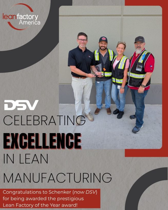A representative from Lean Factory America presents the 2025 Lean Factory of the Year award to the DSV (formerly Schenker) team. Four people stand outside a facility smiling, wearing safety vests, with Lean Factory America and DSV logos shown in the design.